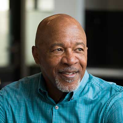 An older black male looking to the right.